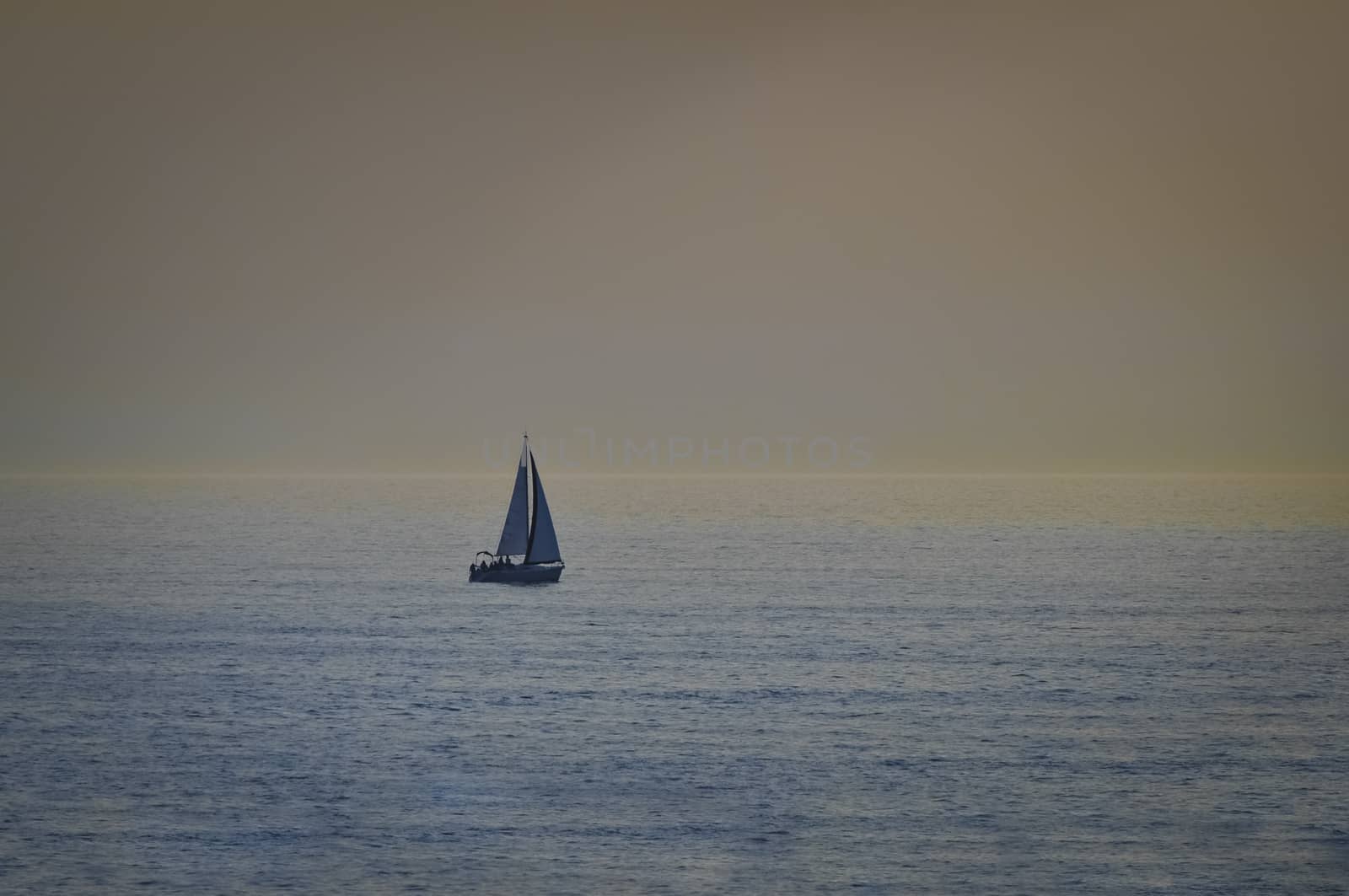 Sail boat in open sea at sunset by asafaric