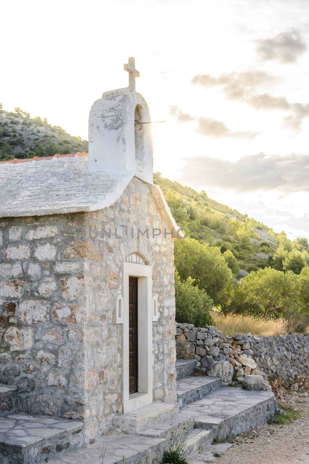 Small stone chappel in the Mediterranean, island of Brac, Croatia / morning daylight