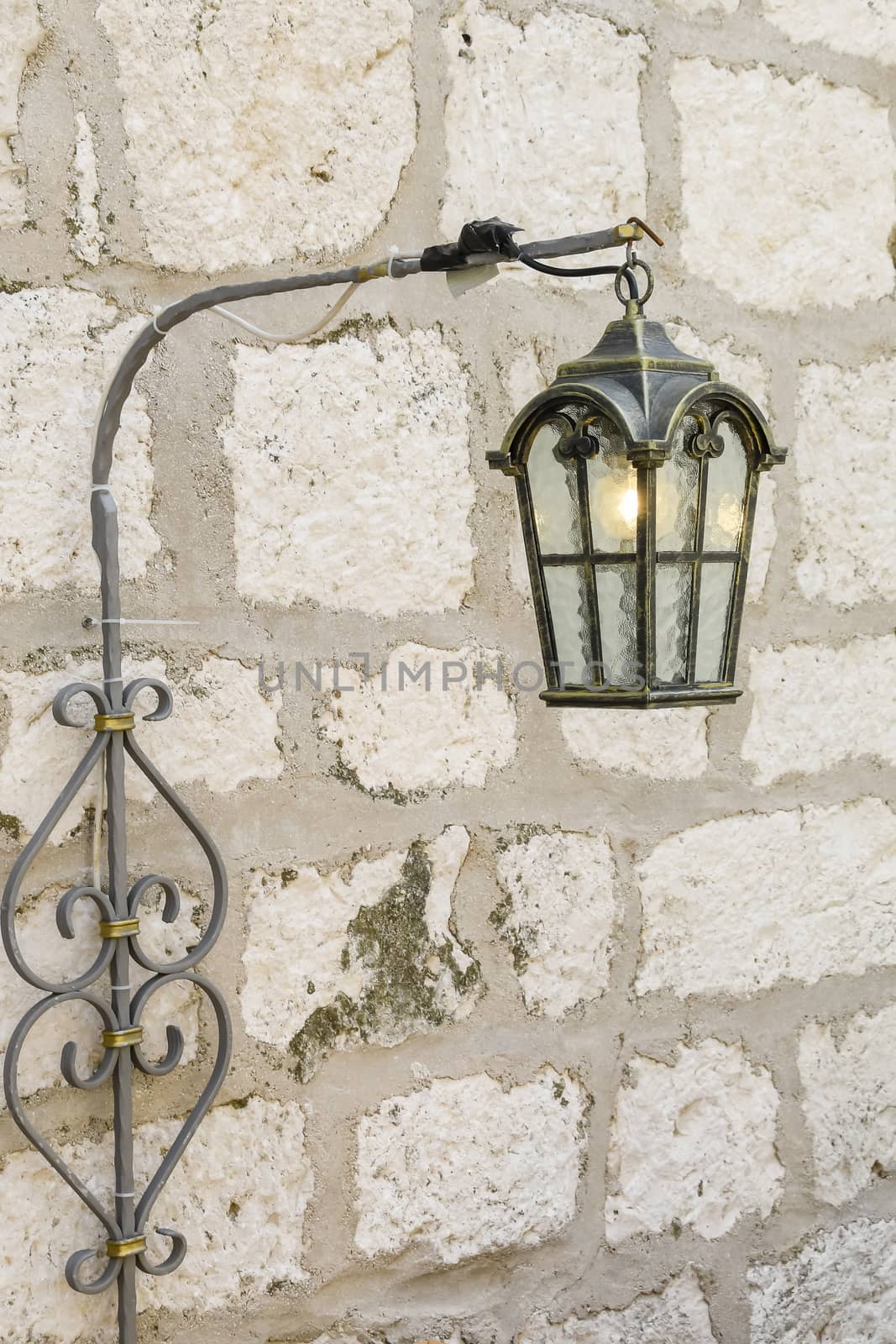 Vintage, old street lamp in classic style, made of cast iron and or metal