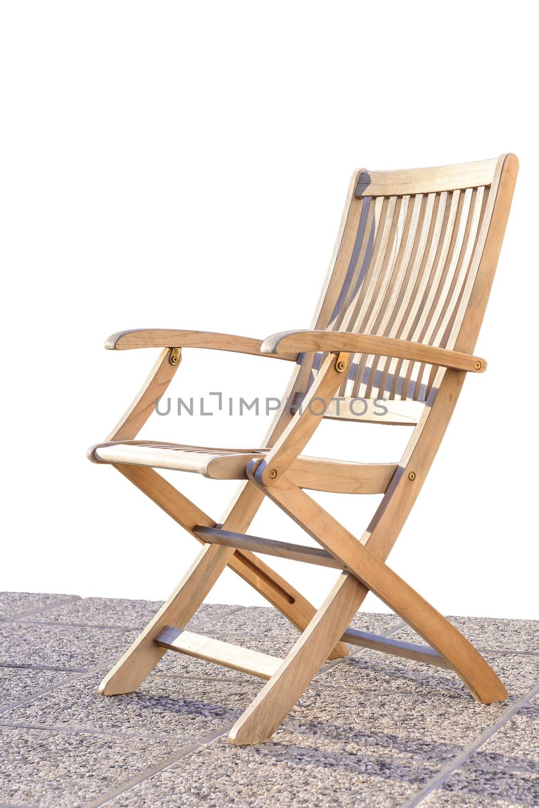 Teak foldable deck chair on terrace by asafaric