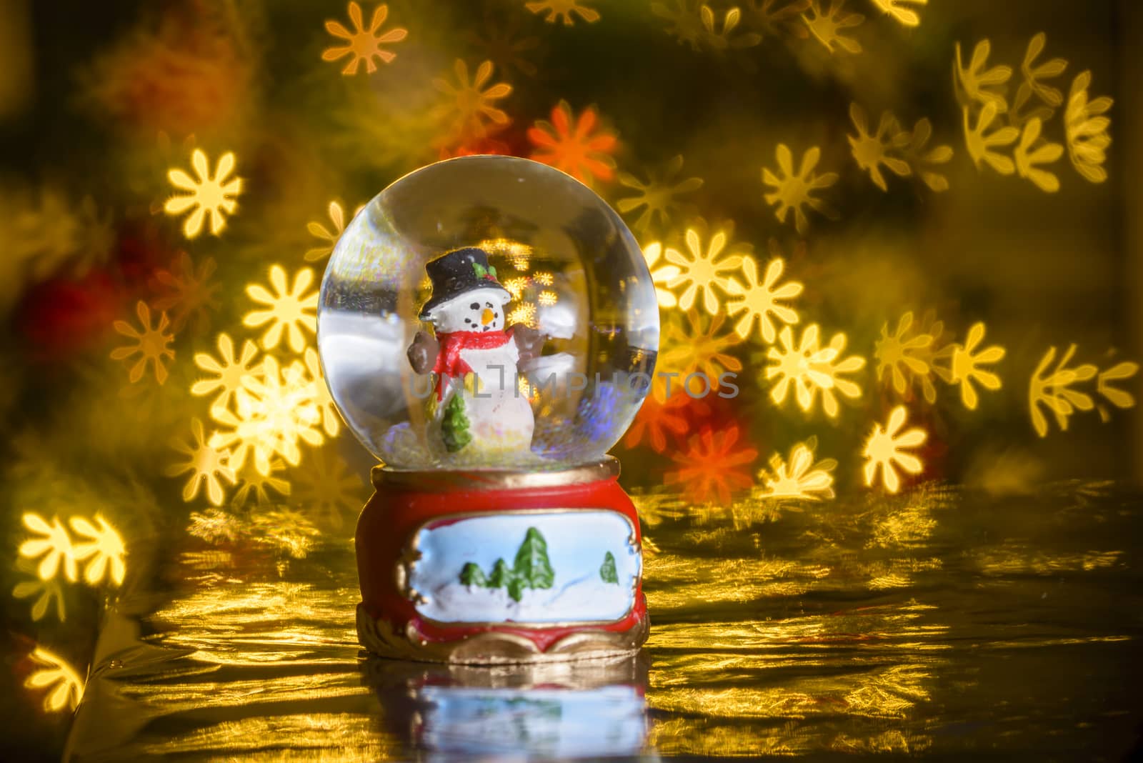 Christmas snowman and flower shaped lights in background, flower shaped bokeh blur, Christmas decoration