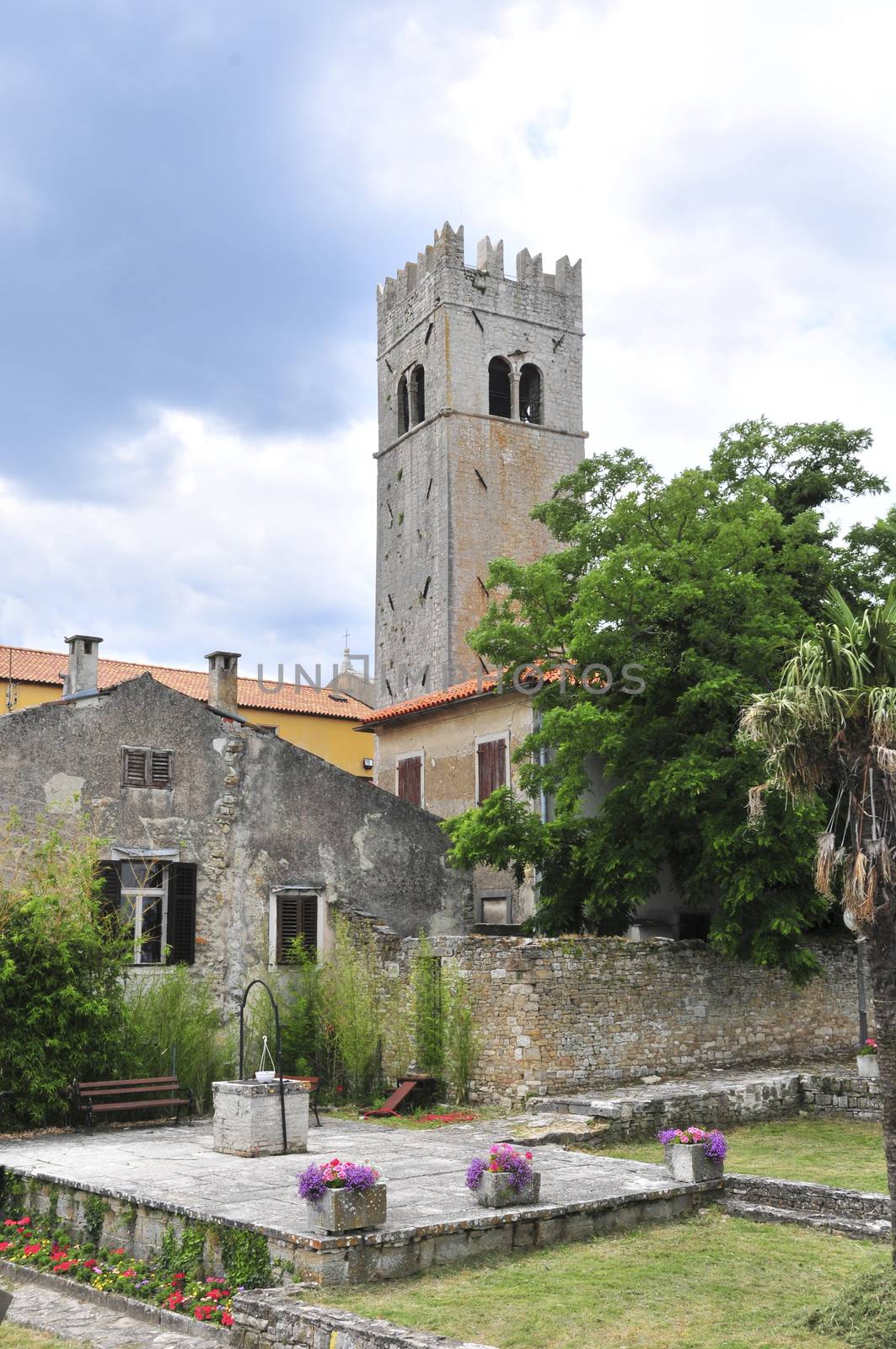 Old town Motovun with tower at city gates by asafaric