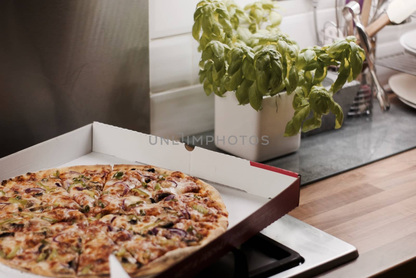 Fresh and tasty vegetarian spicy pizza in the kitchen. Fast food concept.