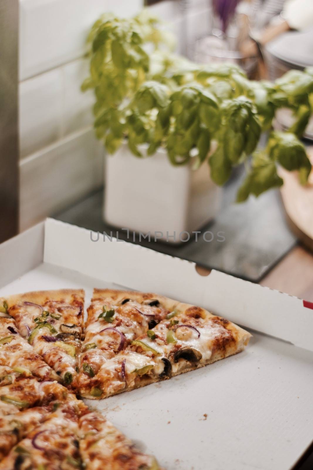 Fresh and tasty vegetarian spicy pizza in the kitchen. Fast food concept.