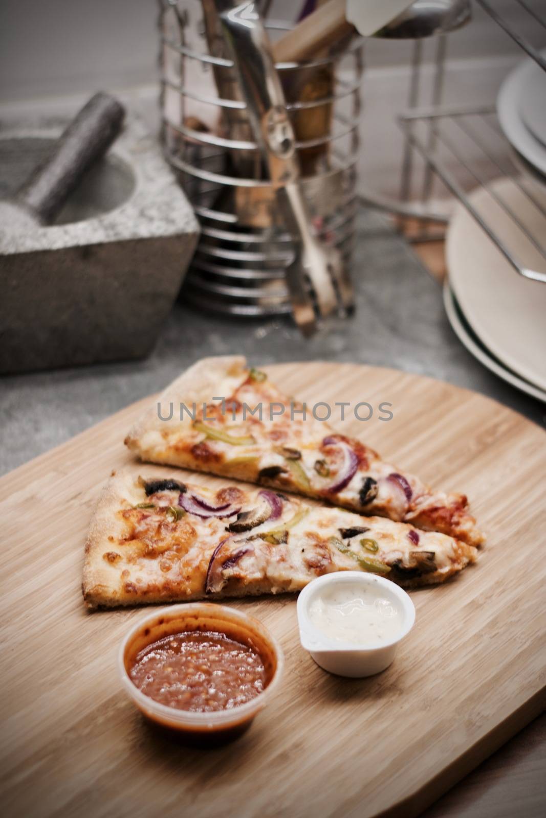 Fresh and tasty vegetarian spicy pizza in the kitchen. Fast food concept.