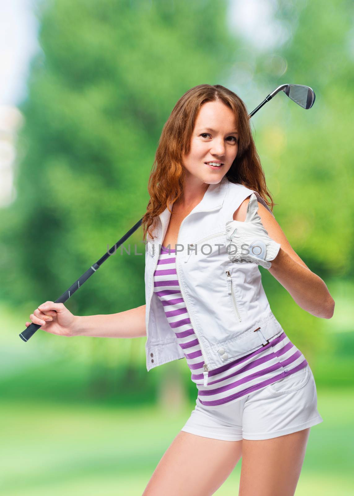 Happy woman with a golf club holds a thumb up on a background of by kosmsos111