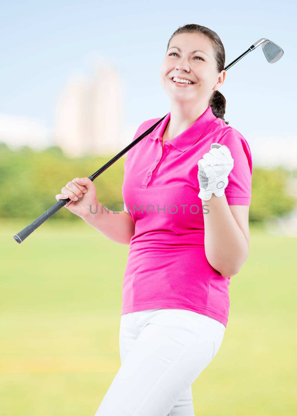 joyful woman golfer enjoys his victory on a background of golf courses