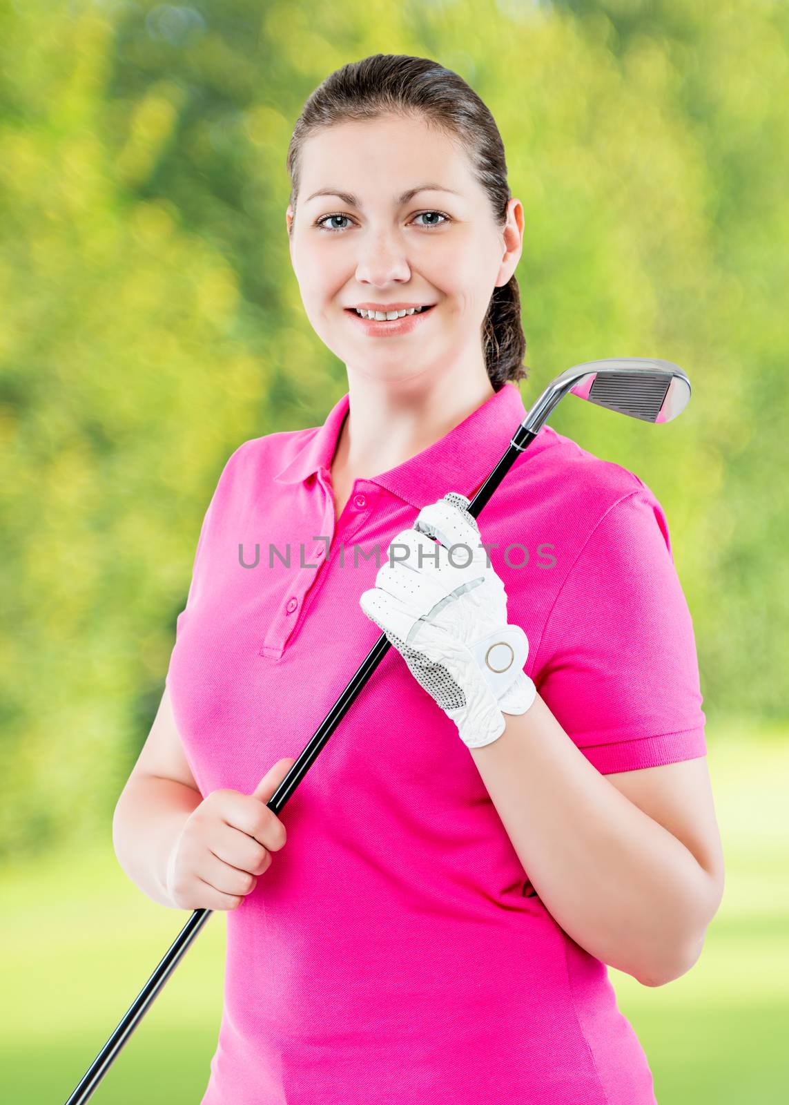 smiling happy woman golfer posing on a background of golf course by kosmsos111