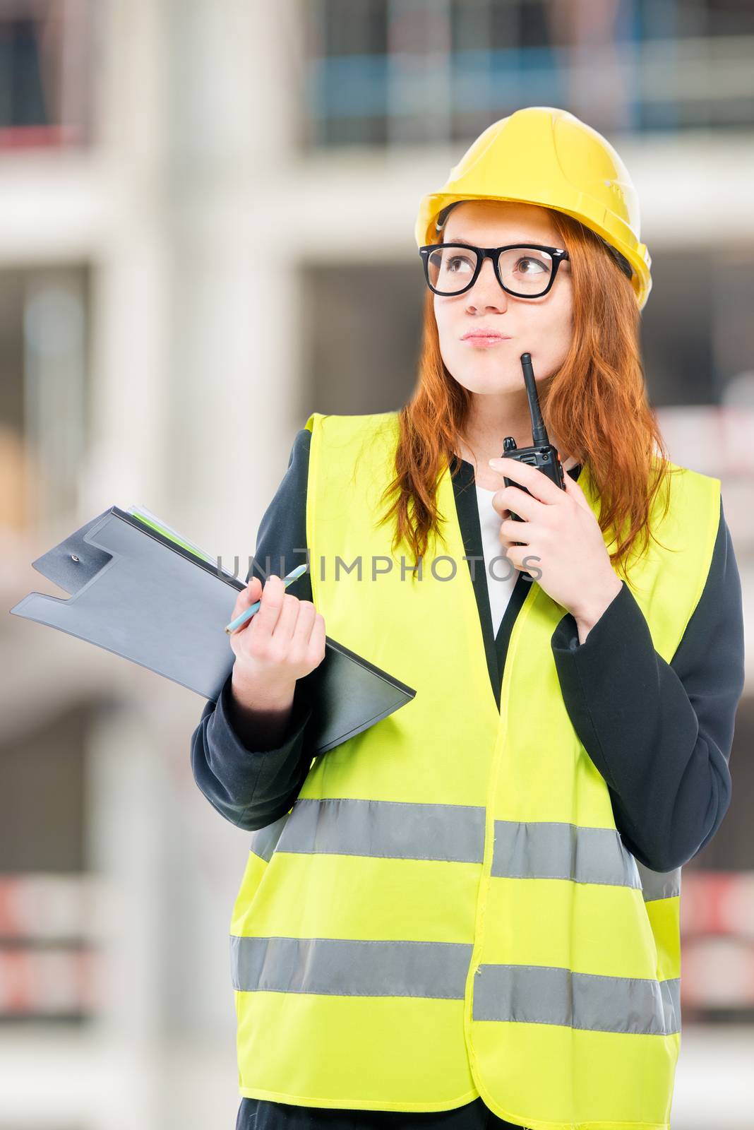 portrait of a brigadier woman with a walkie-talkie on a construc by kosmsos111