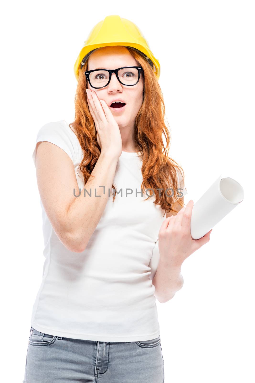 shocked woman in yellow helmet in studio posing