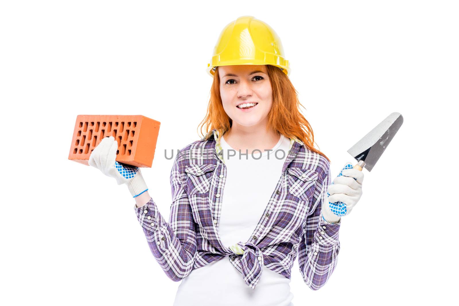 woman builder with a brick and trowel on a white background