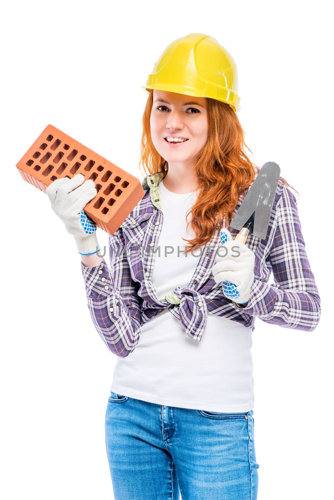 man's profession builder, portrait of woman with brick in yellow helmet