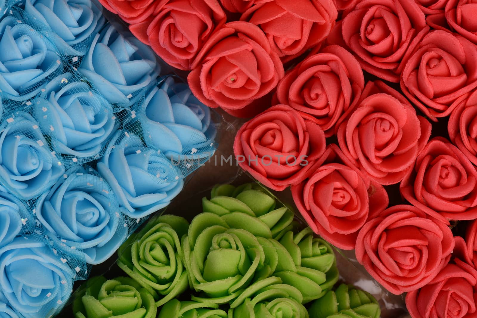Flowers composition. Frame made of artificial flowers background by fotoscool