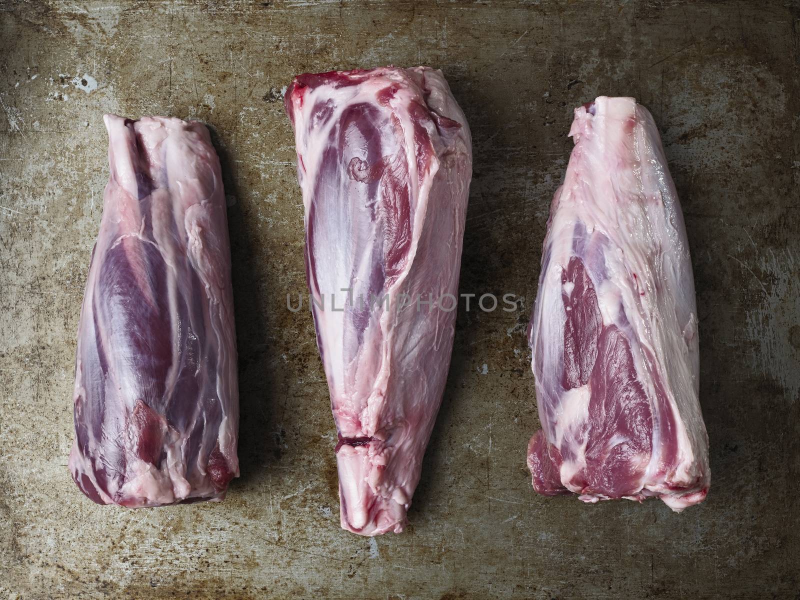 rustic uncooked lamb shank by zkruger