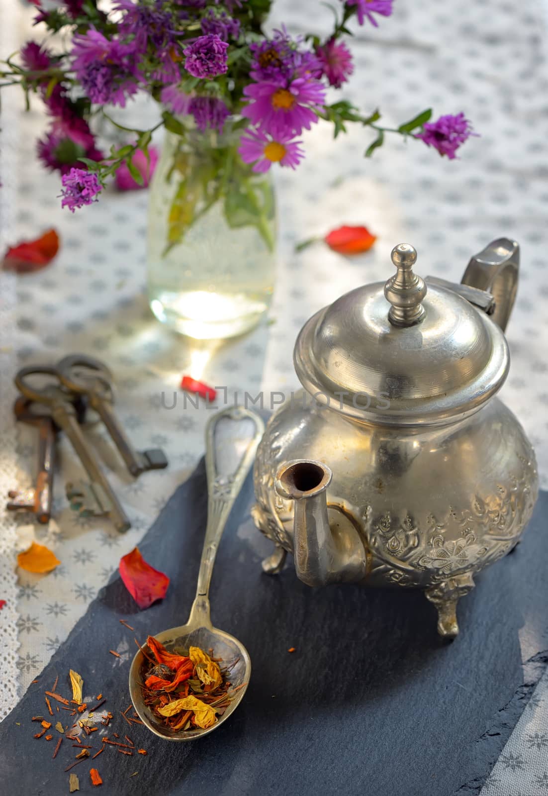 Dry tea leaves on spoon by jordachelr