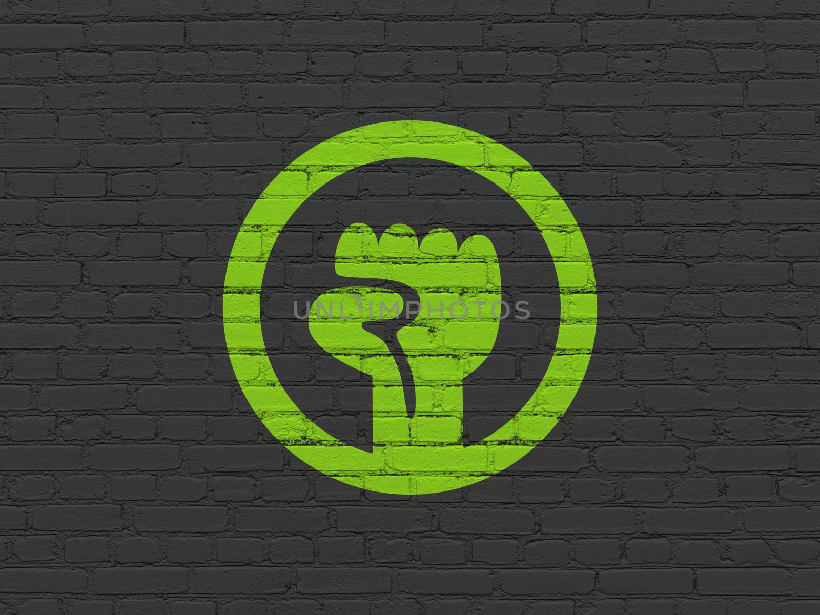 Politics concept: Painted green Uprising icon on Black Brick wall background