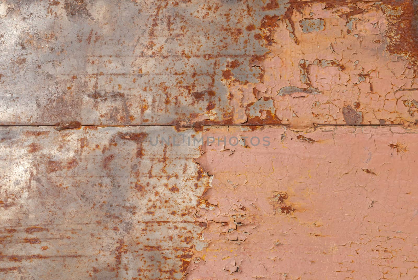 surface of rusty iron with remnants of old paint, chipped paint, background texture by uvisni