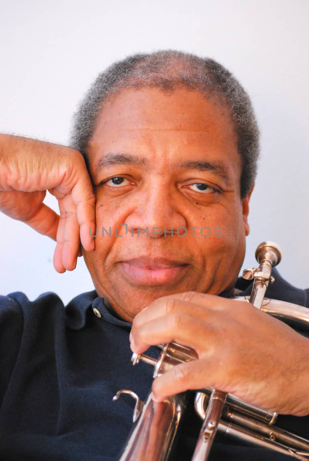 African american jazz musician with his flugelhorn.