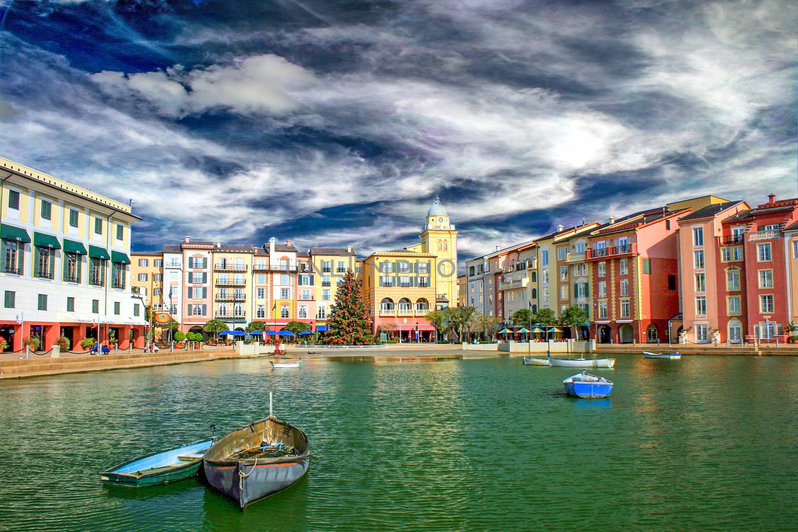 A hotel with boats on a lake.