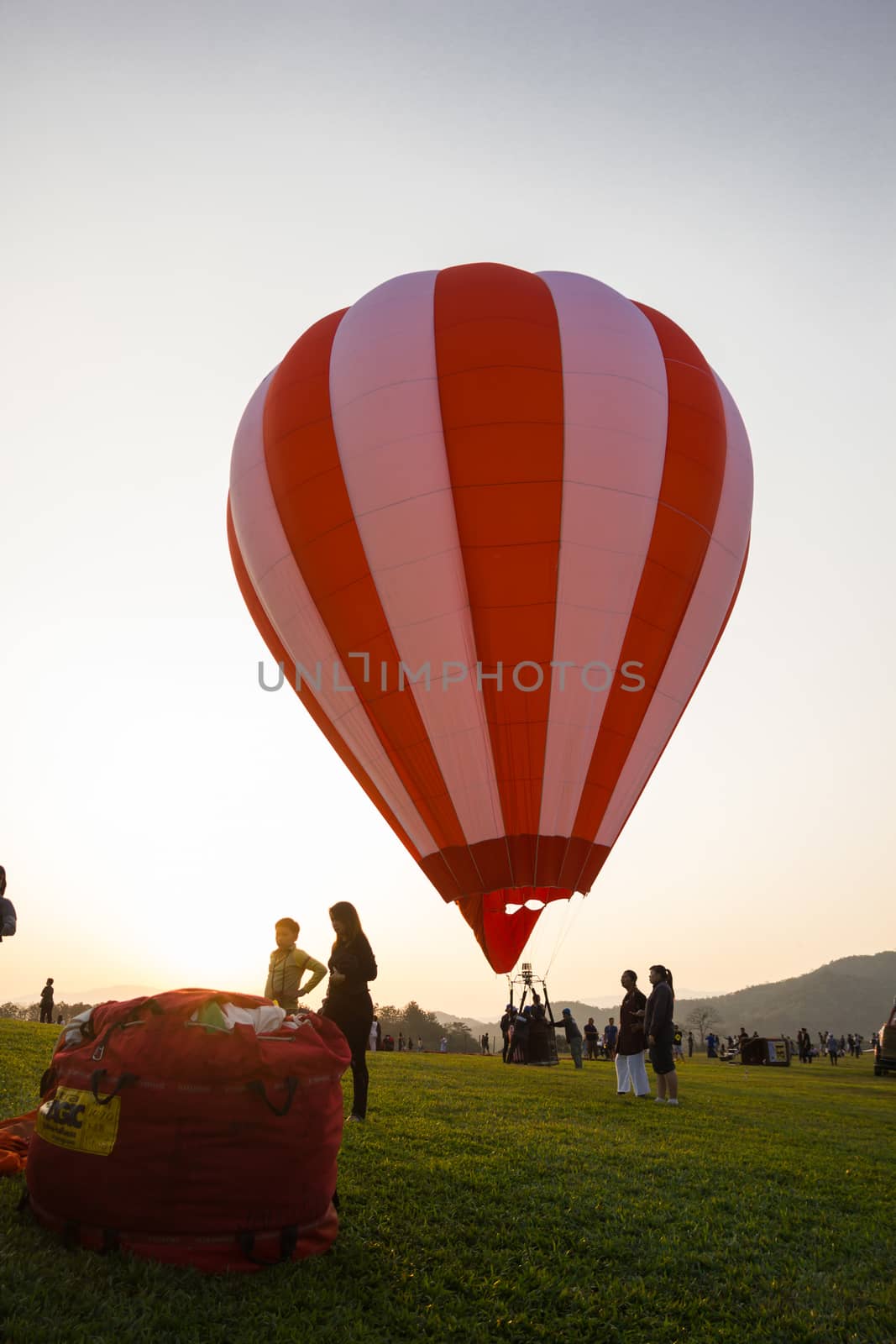 CHIANGRAI, THAILAND - FEBRUARY 15, 2017 : Hot air Balloons ready to rise into the sky in the sunset at SINGHA PARK CHIANGRAI BALLOON FIESTA 2017, Chiangrai province, Thailand