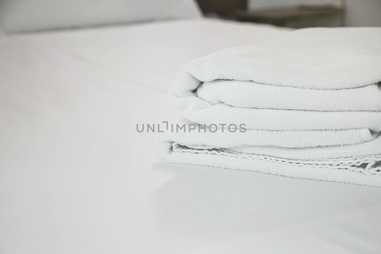 white towel on white mattress fabric, soft light in the morning