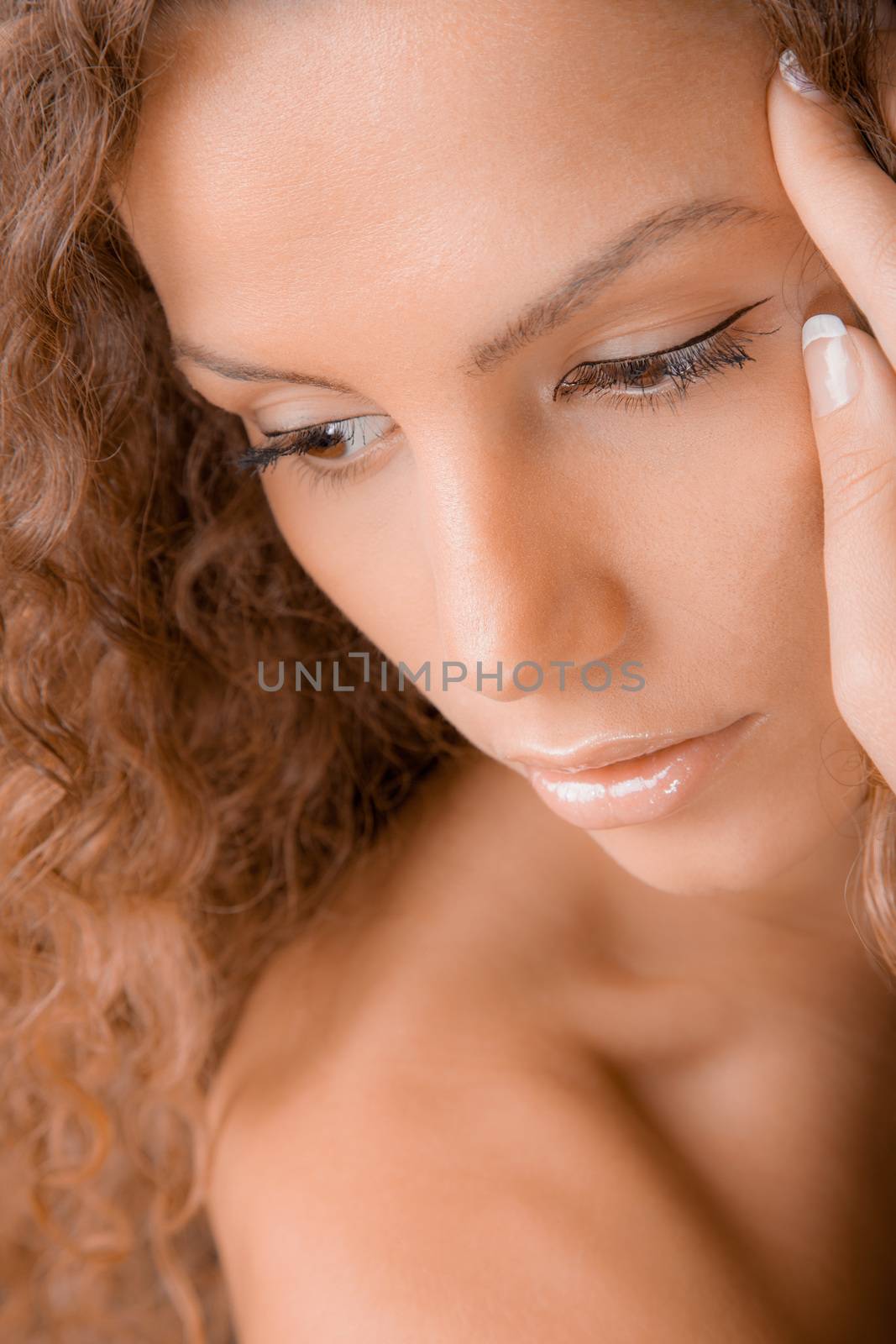 A close-up beauty portrait of a gorgeous young woman.