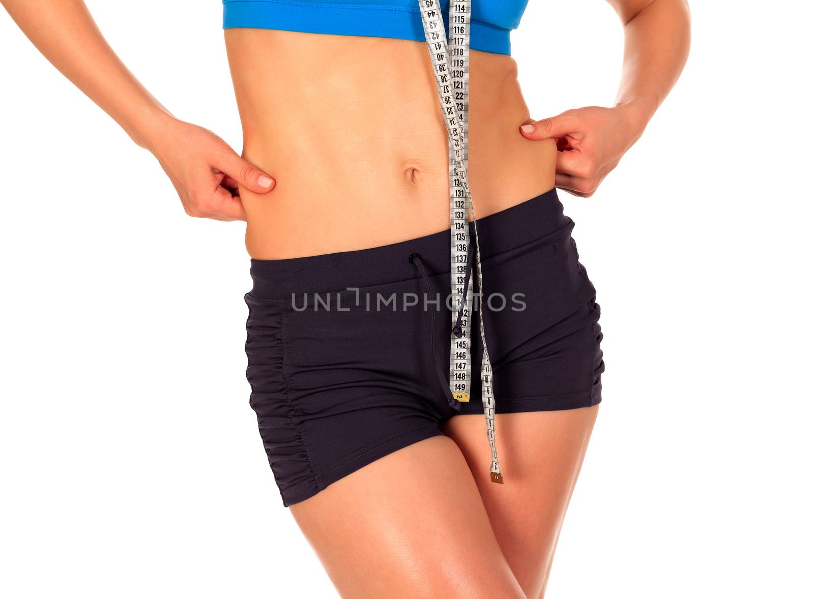 Fit woman pinches fat on her sides, isolated on white background by Nobilior