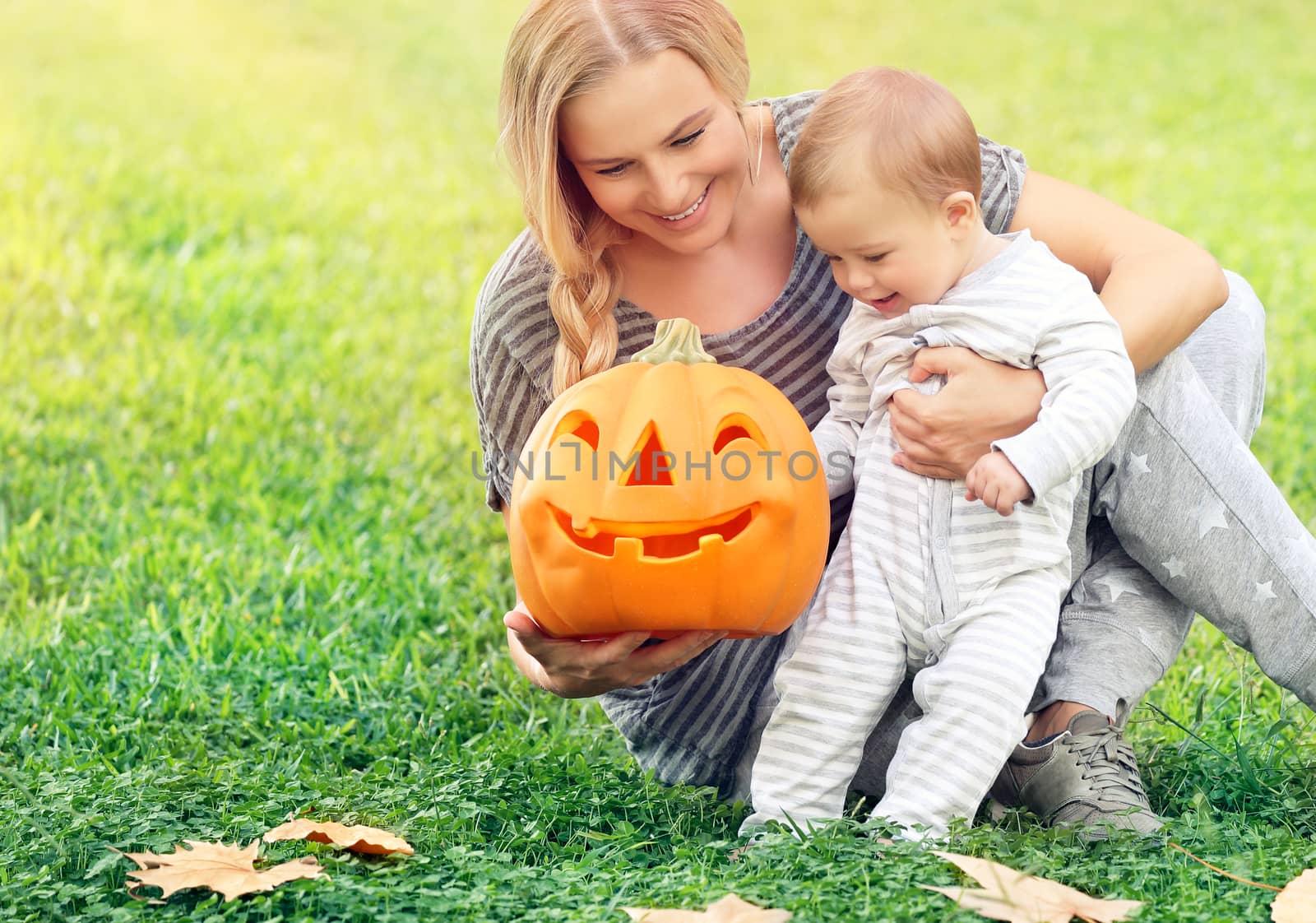 Happy mother with baby in Halloween holiday by Anna_Omelchenko