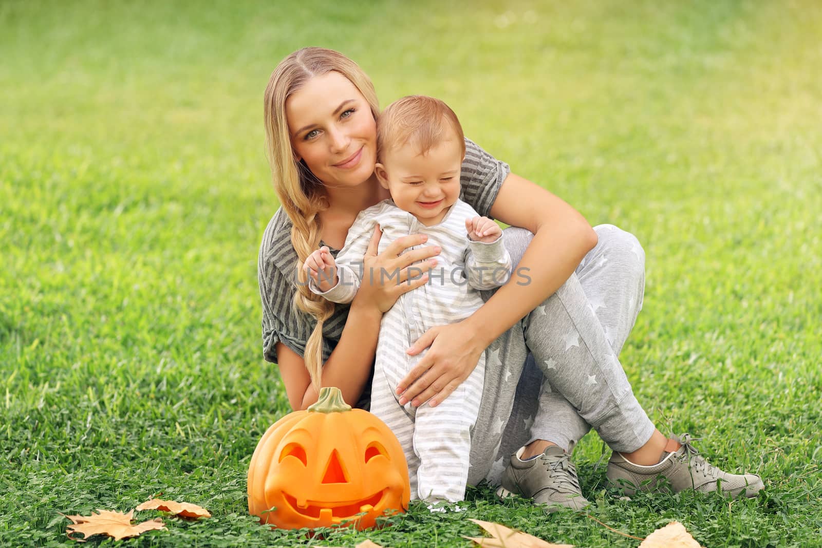 Happy mother with baby outdoors by Anna_Omelchenko