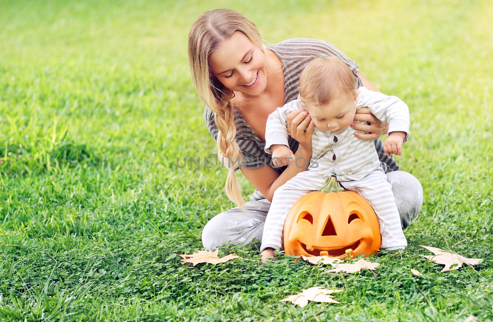 Happy mother with son celebrate Halloween by Anna_Omelchenko