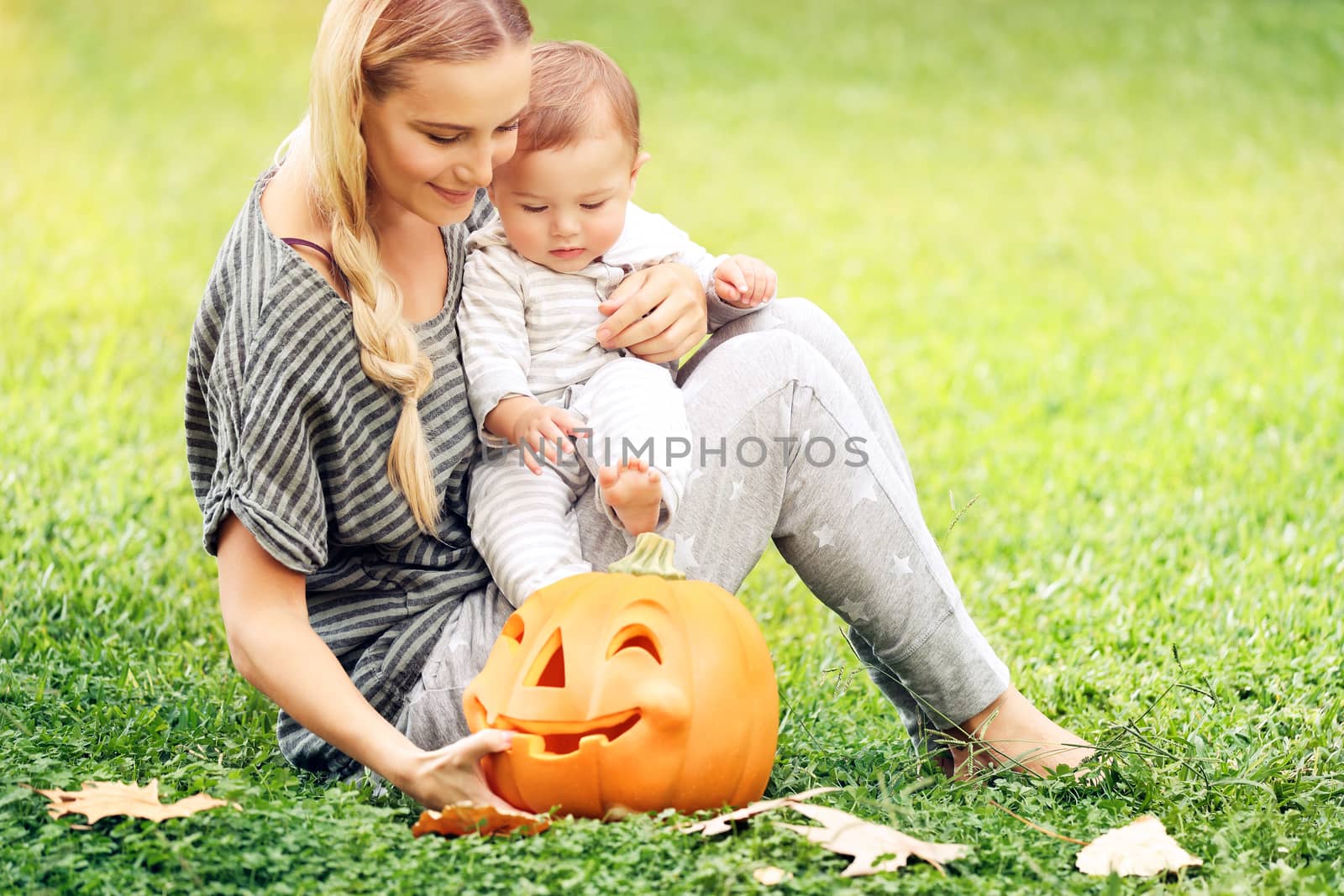 Happy mother and baby outdoors by Anna_Omelchenko
