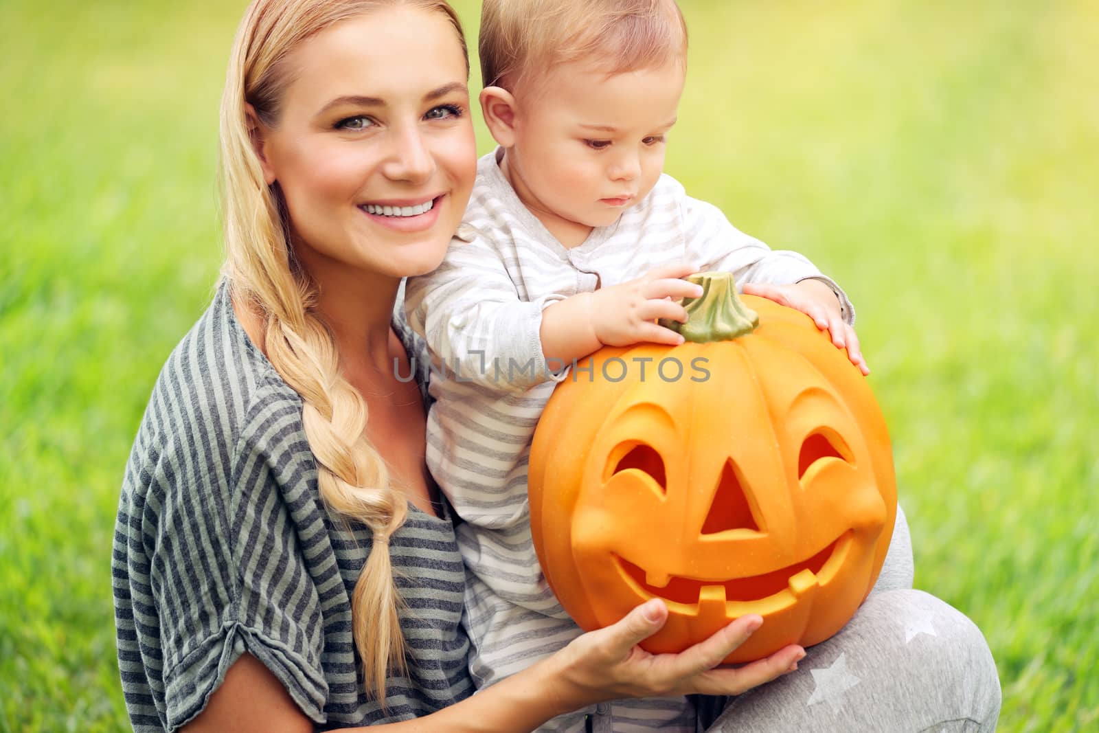 Happy family with Halloween pumpkin by Anna_Omelchenko