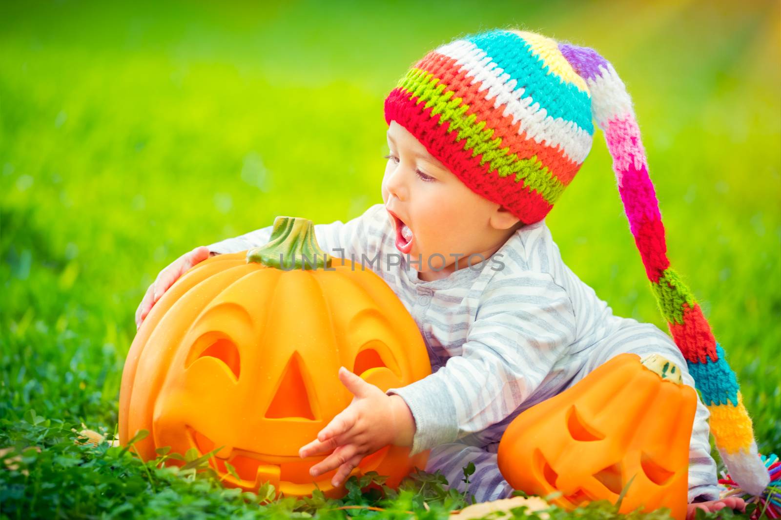 Cute baby with Halloween pumpkins by Anna_Omelchenko