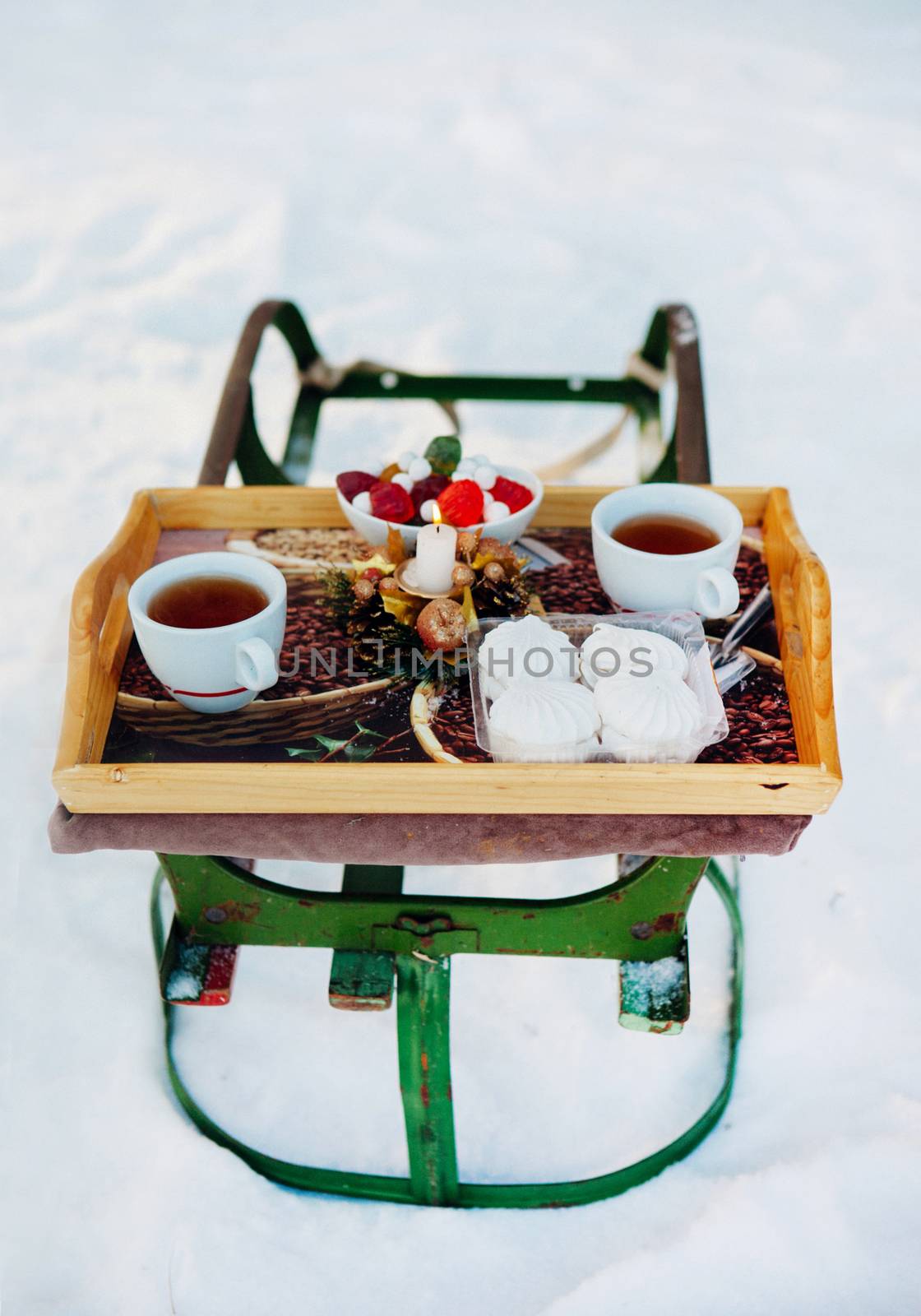 Romantic breakfast in the snow. Winter Vintage Sledge. Coffee, marshmallows, and other sweets by sermax55
