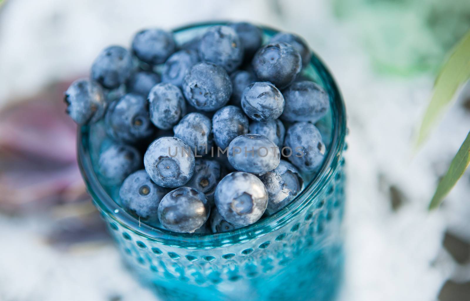 Useful blueberry berry in a vintage cup close-up