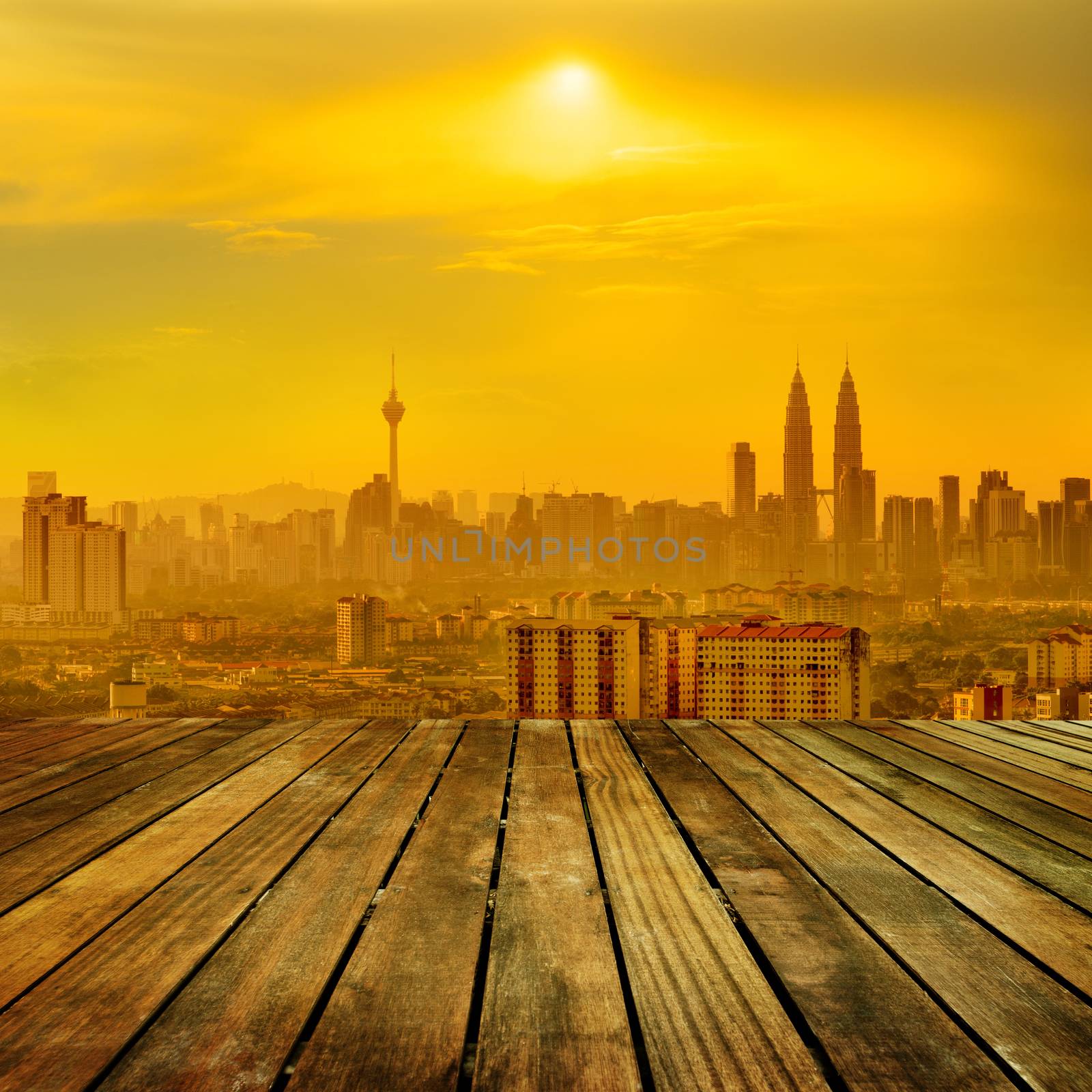 Kuala Lumpur city skyline view from wooden platform.