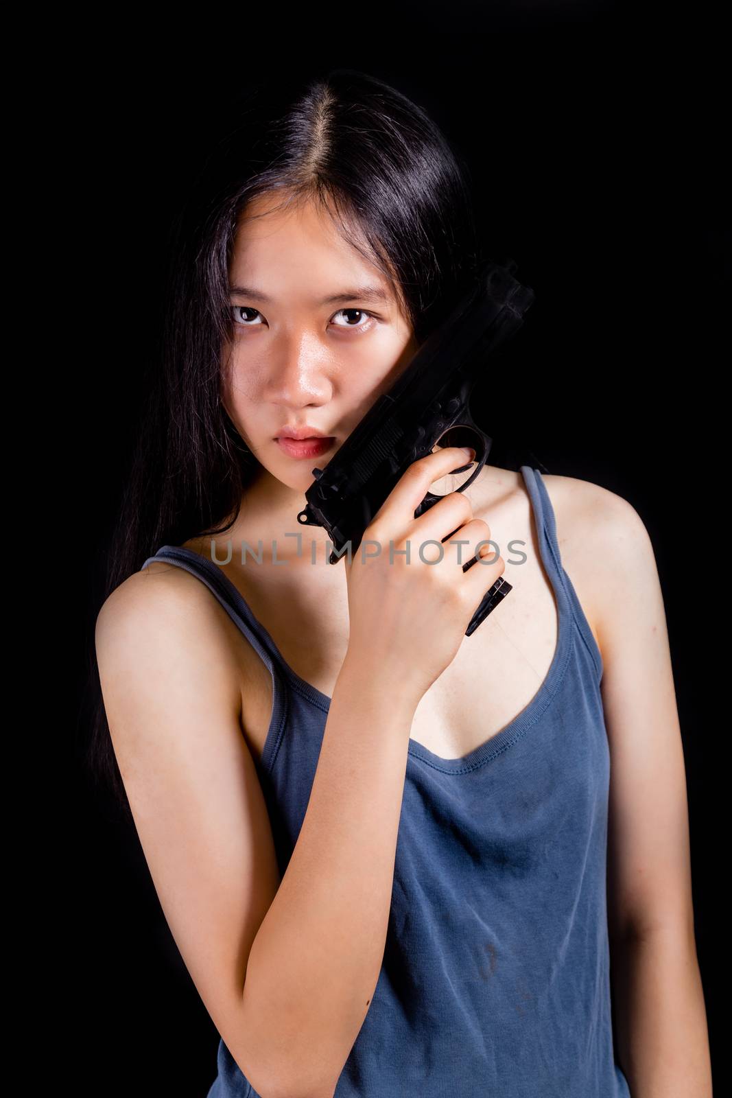 Teenage Asian girl with pistol by imagesbykenny