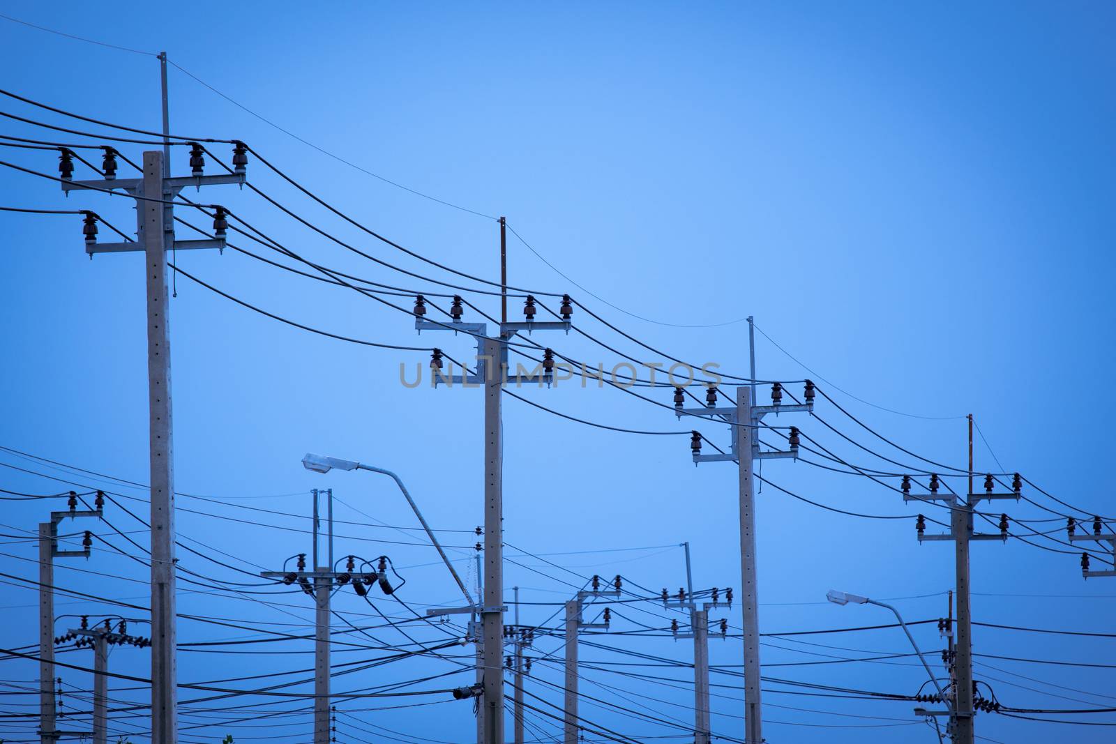 row of electric transmission pylon