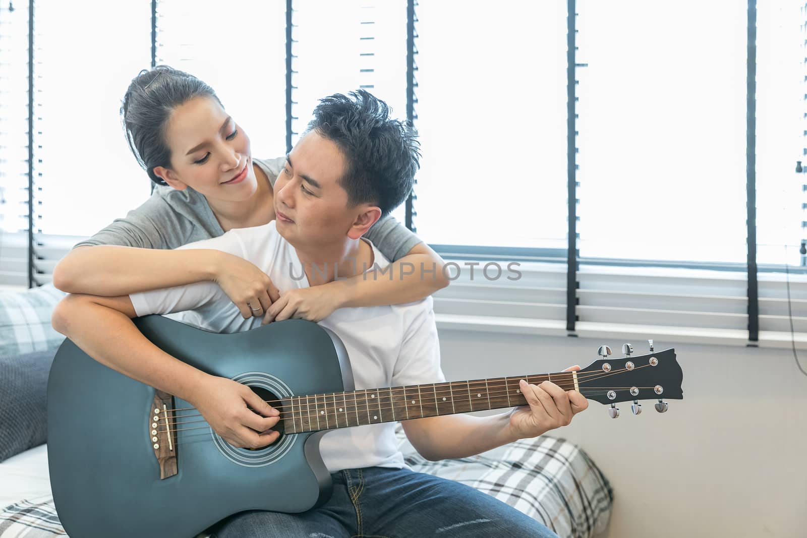 Couples playing guitar by vichie81
