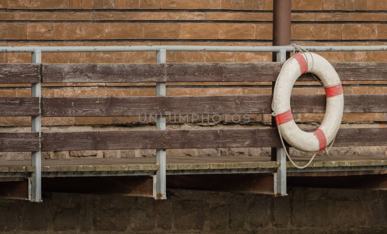 A rescue ring hangs on the bridge