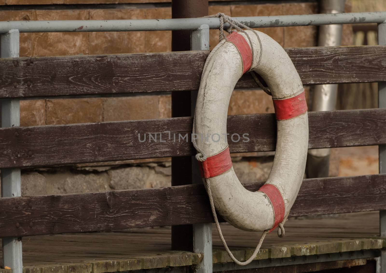 A rescue ring hangs on the bridge