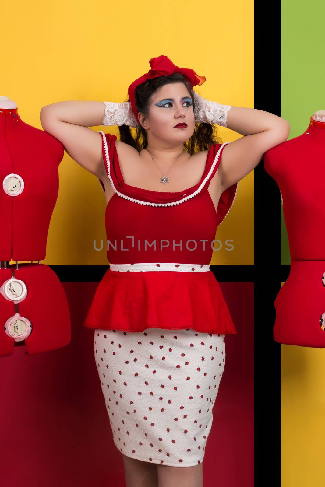 View of pinup vintage girl next to a colorful pop art backdrop.