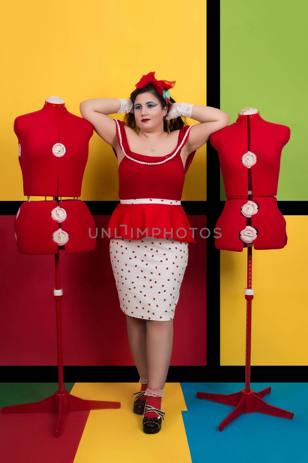 View of pinup vintage girl next to a colorful pop art backdrop.