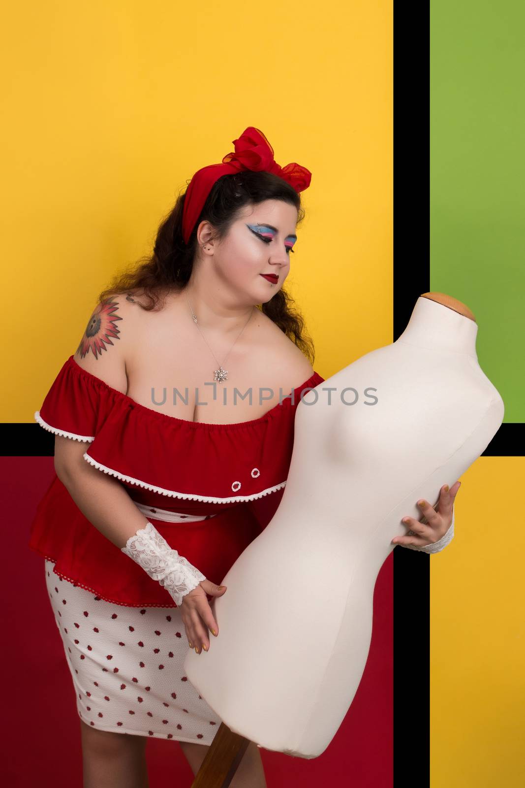 View of pinup vintage girl next to a colorful pop art backdrop.