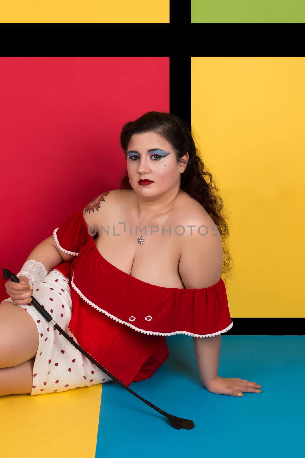 View of pinup vintage girl next to a colorful pop art backdrop.