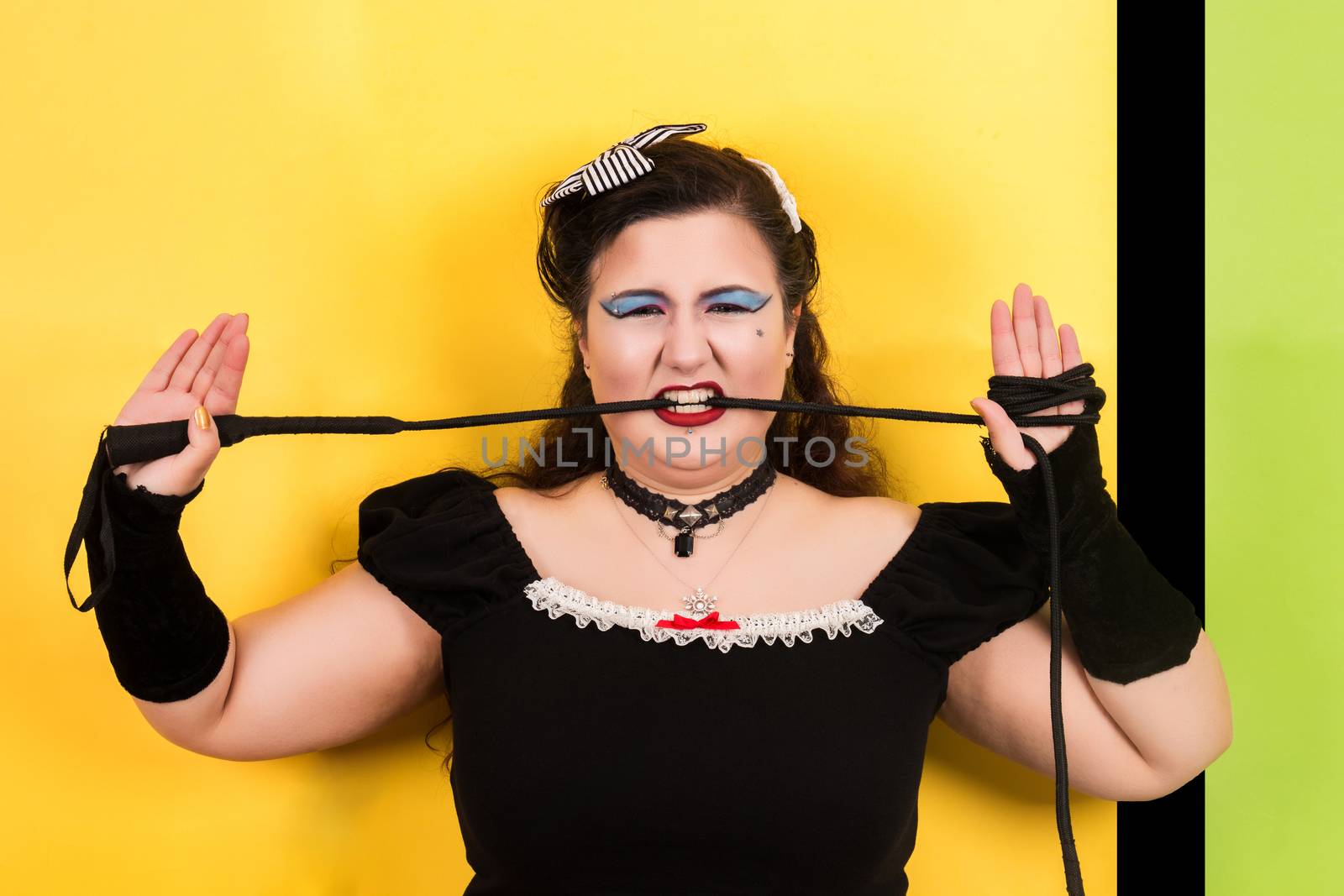 View of pinup vintage girl next to a colorful pop art backdrop.