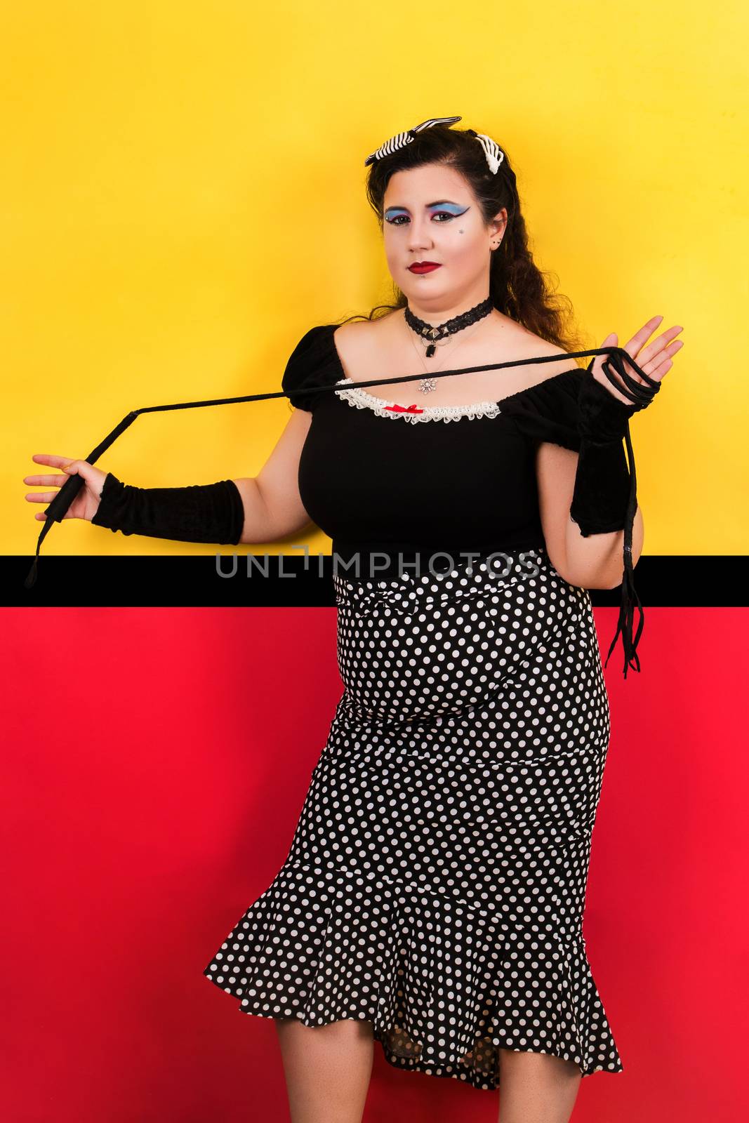 View of pinup vintage girl next to a colorful pop art backdrop.