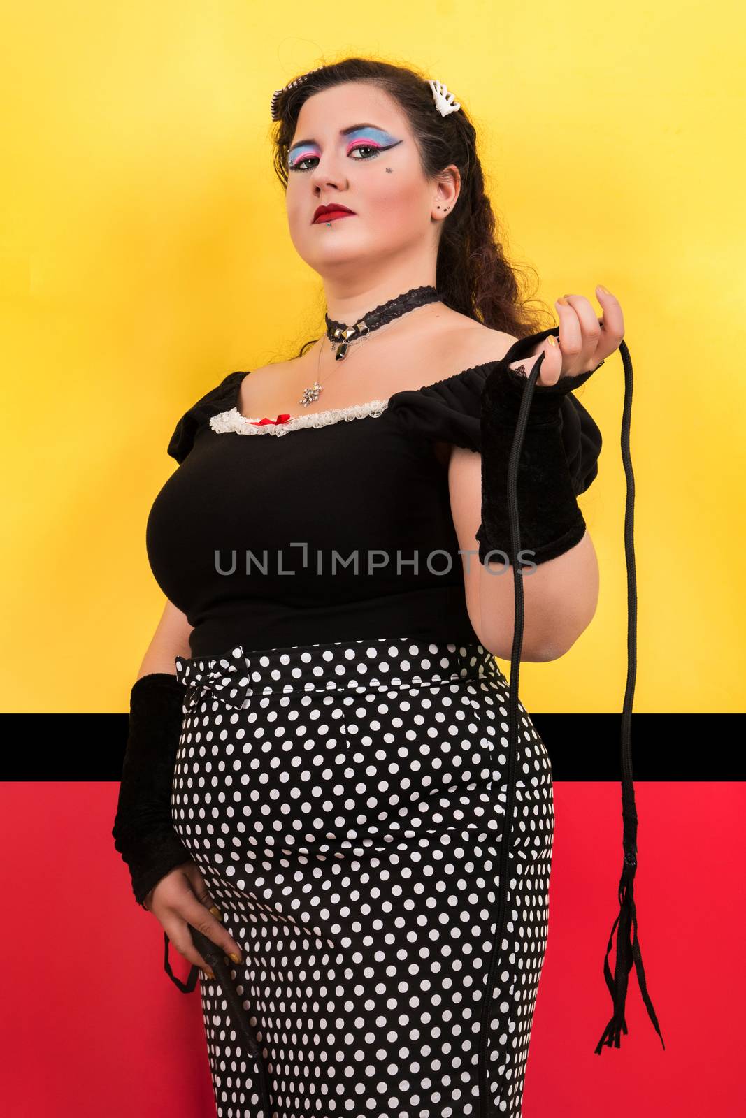 View of pinup vintage girl next to a colorful pop art backdrop.