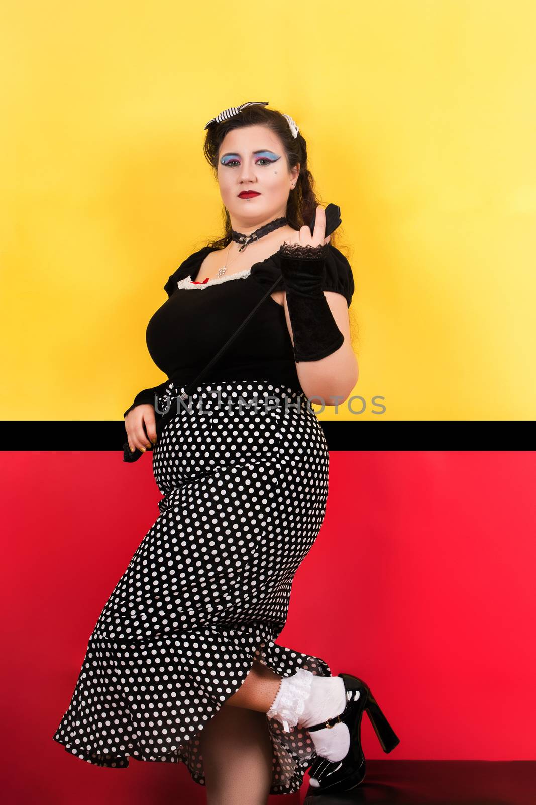 View of pinup vintage girl next to a colorful pop art backdrop.