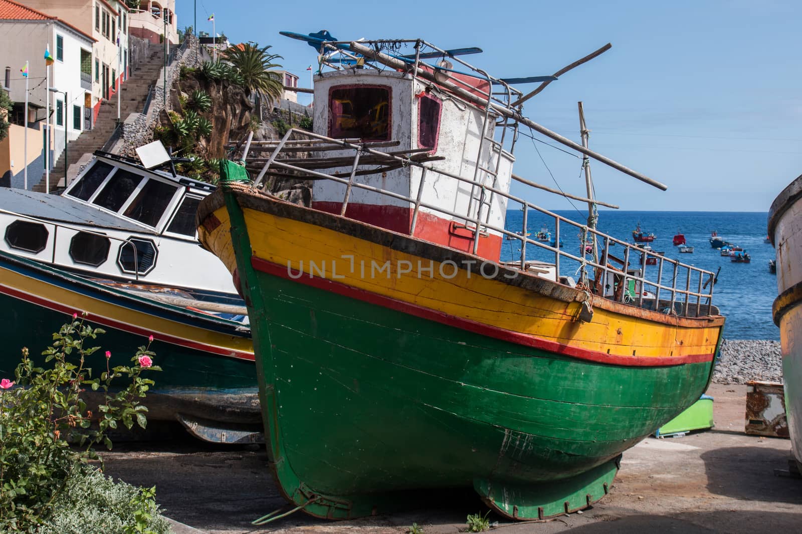 Traditional fishing boats on the shoreline of Camara de Lobos, Madeira.